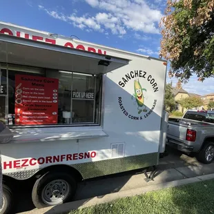 a food truck parked on the side of the road