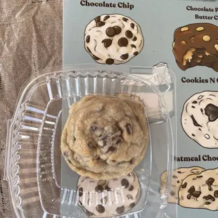 a chocolate chip cookie in a container