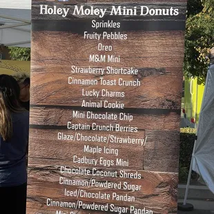 a sign for a variety of donuts