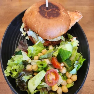 Fried chicken sandwich with a beautiful light salad