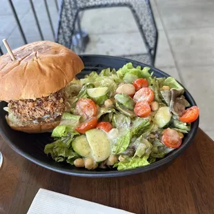 Fried chicken sandwich with side salad