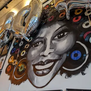 a woman's face on a wall