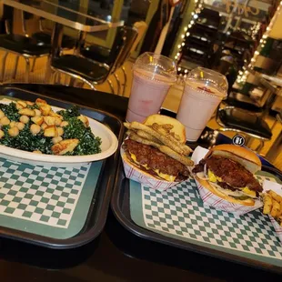 two trays of food on a table