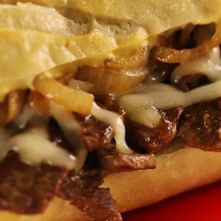 Philly Cheesesteak sandwich 
(The Philly Cheesesteak Sandwich contains beef, provolone cheese, mushrooms, onions, and green bell peppers.)