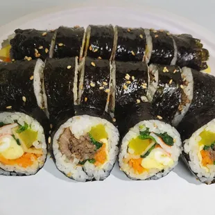 Gimbap
(Gimbap is a Korean dish made from cooked rice, vegetables, fish, and meat rolled in gim dried sheets of seaweed)