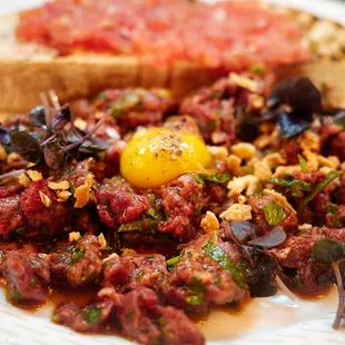 Wagyu beef tartare - catalan spices, spicy garlic, quail egg, pan con tomate