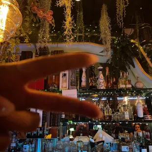 a hand pointing at a bar
