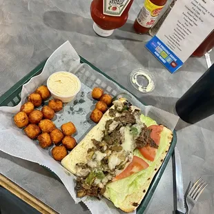 Cheese steak with sweet potato tots