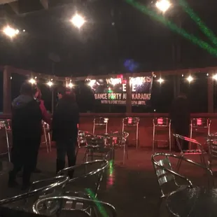 two people standing in a bar