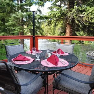 Harmel's back deck overlooks the beautiful Taylor River - a great place to dine!