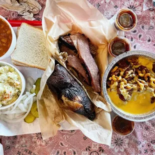 Our meal. 1/2 chicken 1/2 brisket with beans, potato salad and side of their brisket mac and cheese.