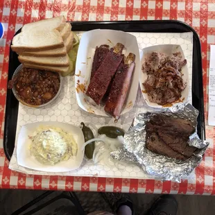 Baked beans, bread, ribs, pork, brisket, onions/jalapeños, potato salad.