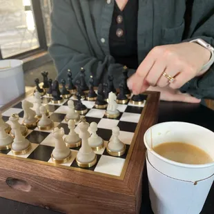 Oat milk cappuccino. We provided our chess set.