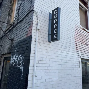 Blade sign near entrance.