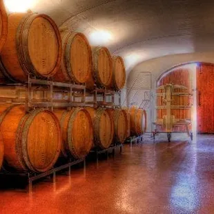 Wine Cave interior with aging red wine.