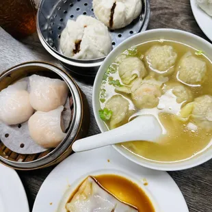 a bowl of soup, dumplings, and dumplings