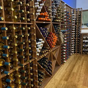 a wine rack full of wine bottles