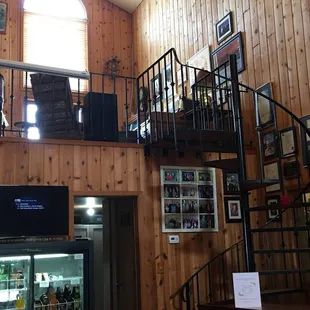 a spiral staircase leading to a second floor