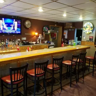 a bar with a television in the background