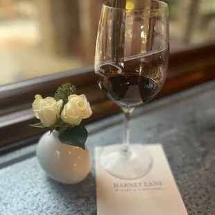 a glass of wine on a table