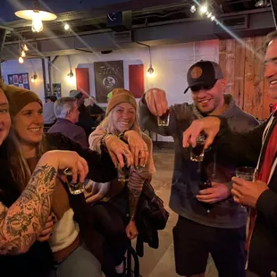 a group of people enjoying a drink