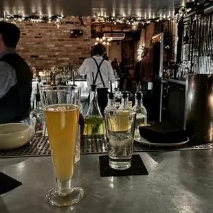 a bar with several glasses of beer