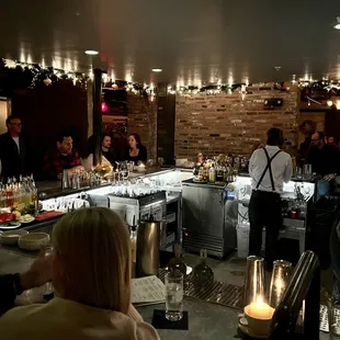 a group of people sitting at a bar