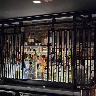 a bar with bottles of alcohol