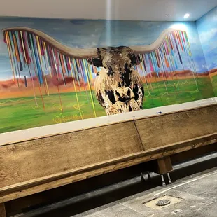 a cow on a bench