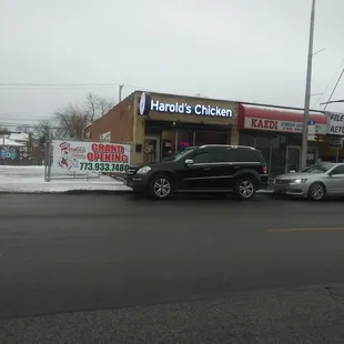 a car parked in front of a restaurant