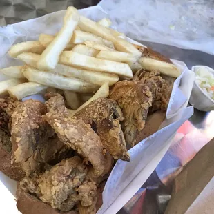 a basket of fried chicken and french fries