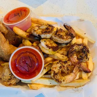 Shrimp and Wing basket served over fries !!