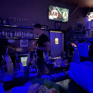 a man working behind the bar