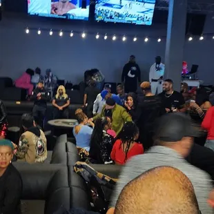 a crowd of people in a bar