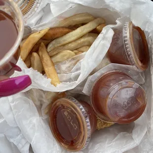 1/4 Dark Meat Chicken Dinner with fries and a bunch of Sauce