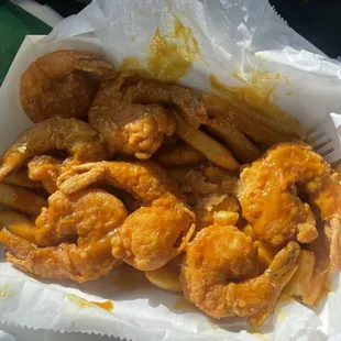 a basket of fried chicken and fries