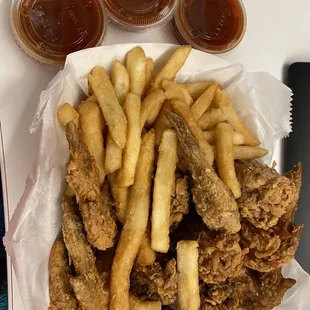 a tray of fried chicken and french fries
