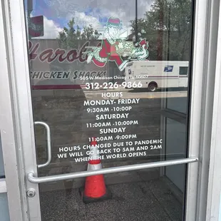 Picture of hours listed on the door.