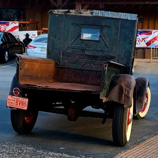 an old car in a parking lot