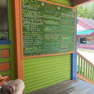 Menu outside. Pick your table, order at the counter and pick your food up when called. Great place great food!