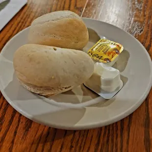 a sandwich and butter on a plate