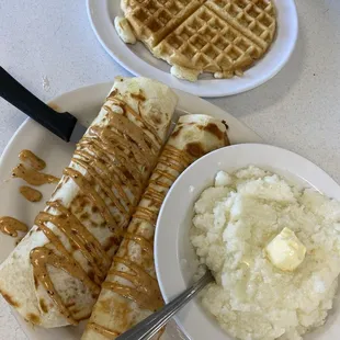 Breakfast burrito, grits and waffle