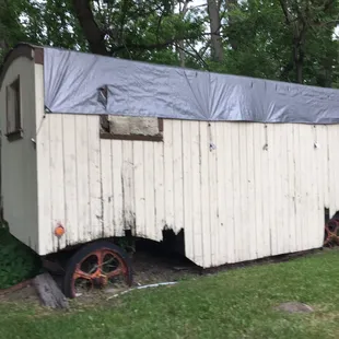 a trailer with a tarp on top