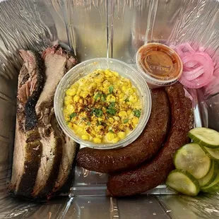 grilled meat, corn, and pickles