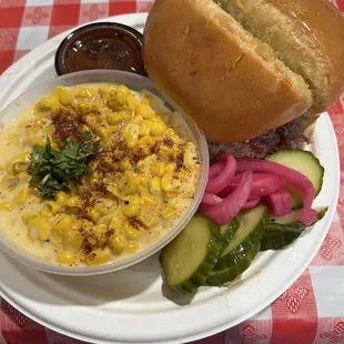 Brisket sandwich with cheesy corn.