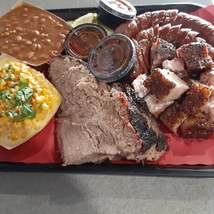 Baked beans and cheesy corn, brisket, pork belly burnt ends, sausage