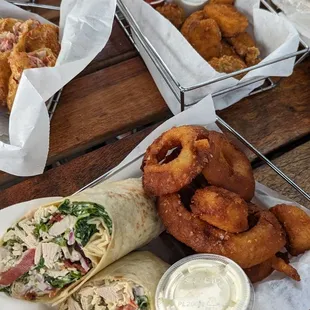a variety of food items on a picnic table
