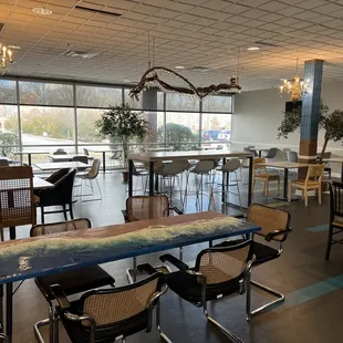 a restaurant with a long table and chairs