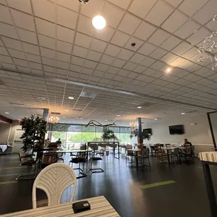 an empty restaurant with tables and chairs