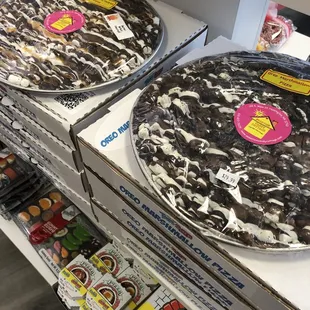 two pizzas on display